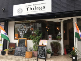 Thilaga Indian outside