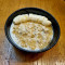 Porridge Served With Raw Cacao And Chocolate Nibs