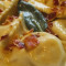 Ravioli Mugellani Di Pasta Fresca Ripieni Di Patate,Con Pancetta Di Cinta, Burro E Salvia